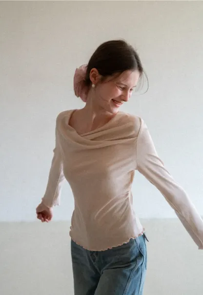 Long sleeve top with ruffled hem and cuffs