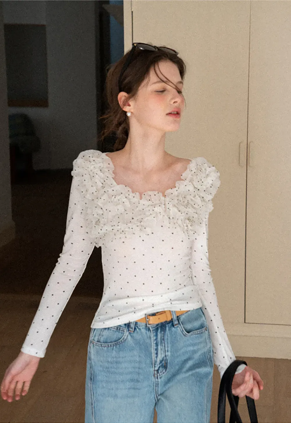 Polka dot long sleeve top with ruffled neckline