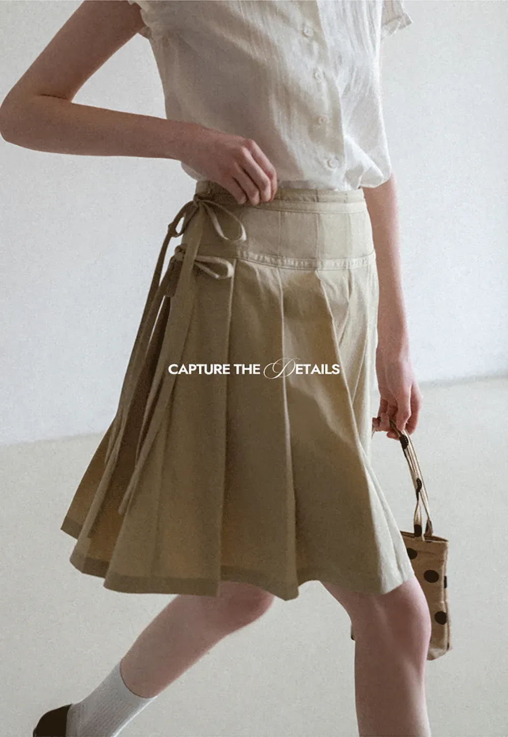 Pleated skirt with side tie waistband