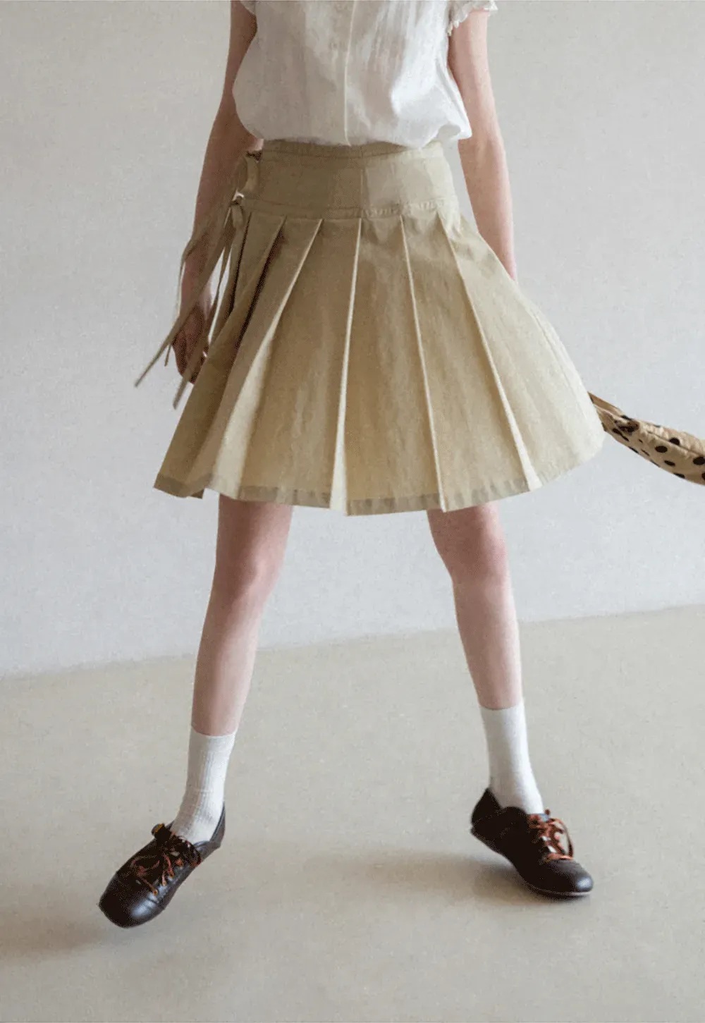 Pleated skirt with side tie waistband