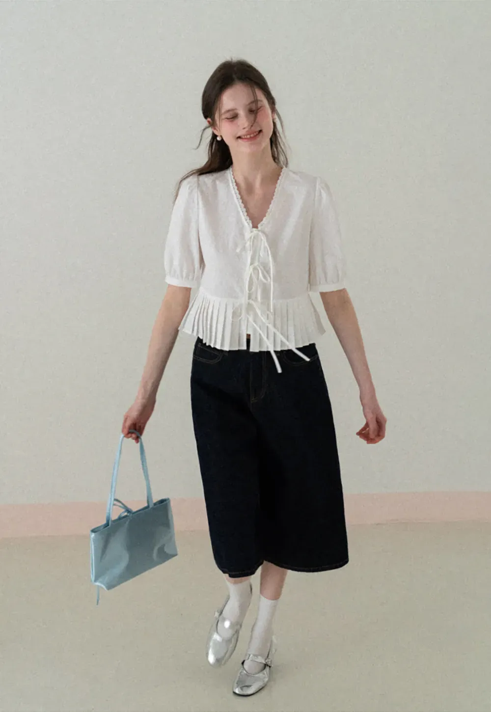 V neck short sleeve blouse with pleated hem and tie front