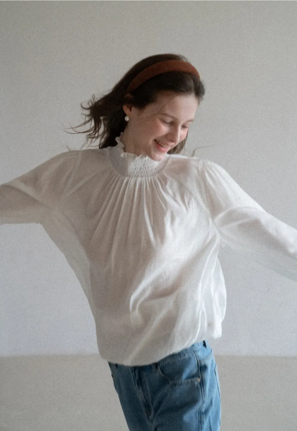 Elegant High Neck Blouse with Ruffled Cuffs and Hem