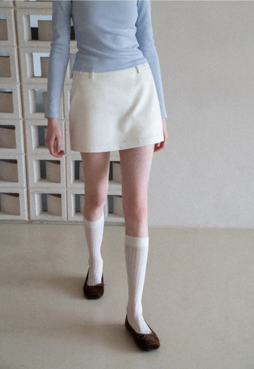 Elegant Pleated Mini Skirt with Asymmetrical Hem