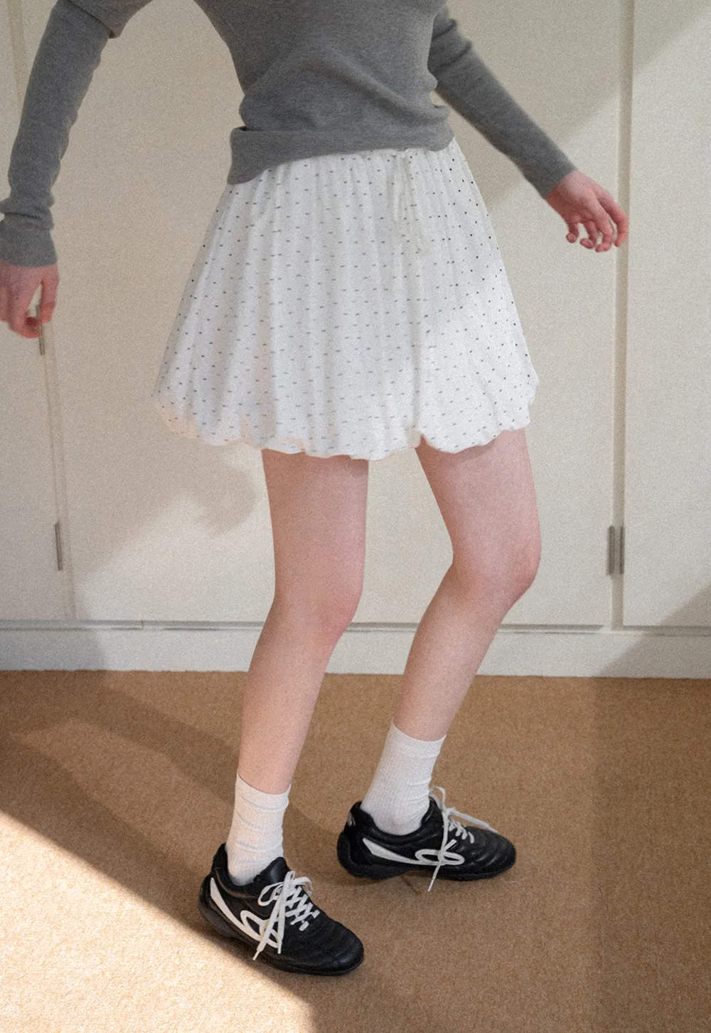 Polka dot pleated mini skirt with drawstring waist