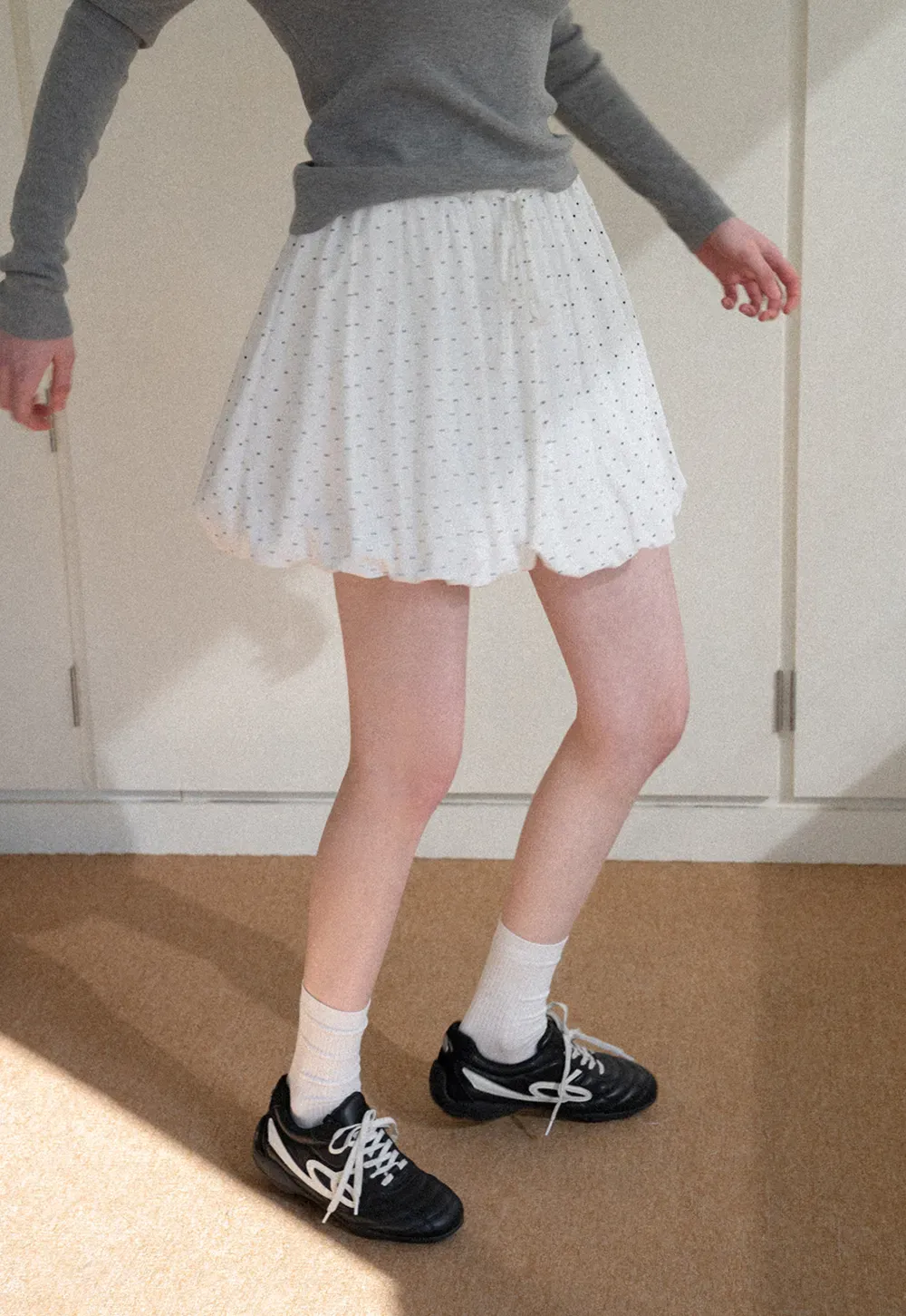 Polka dot pleated mini skirt with drawstring waist