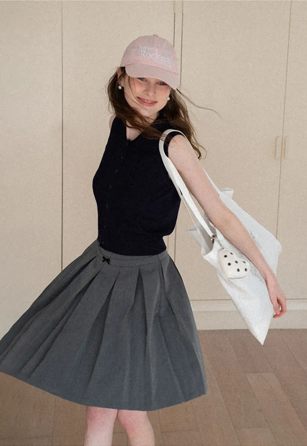 Pleated skirt with front bow detail