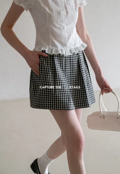 Plaid skirt with pleats and ruffled top