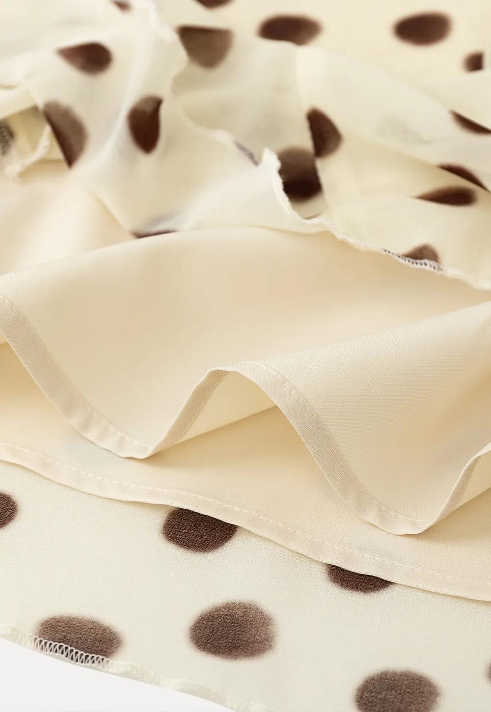 Polka dot ruffled asymmetrical midi skirt