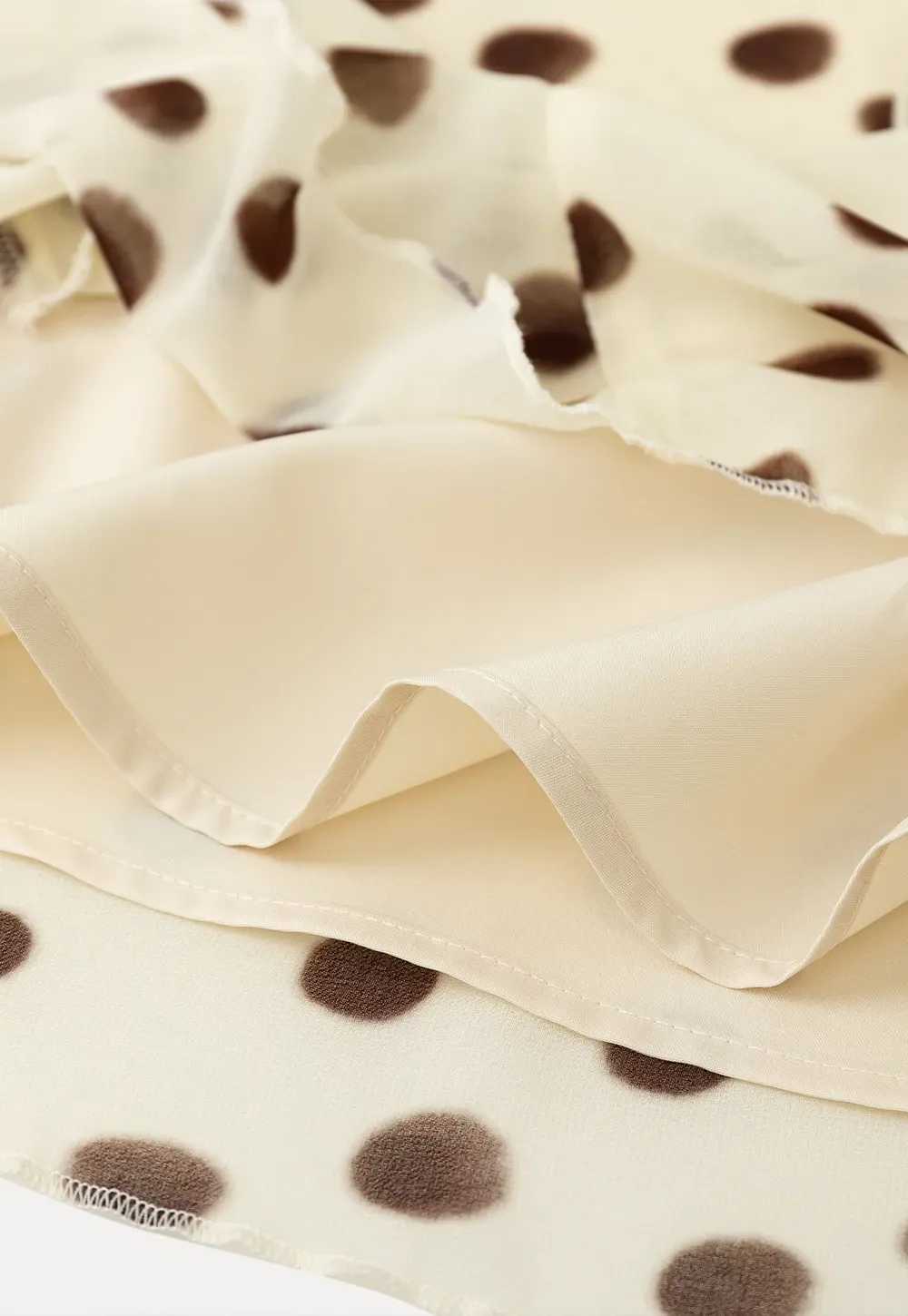 Polka dot ruffled asymmetrical midi skirt