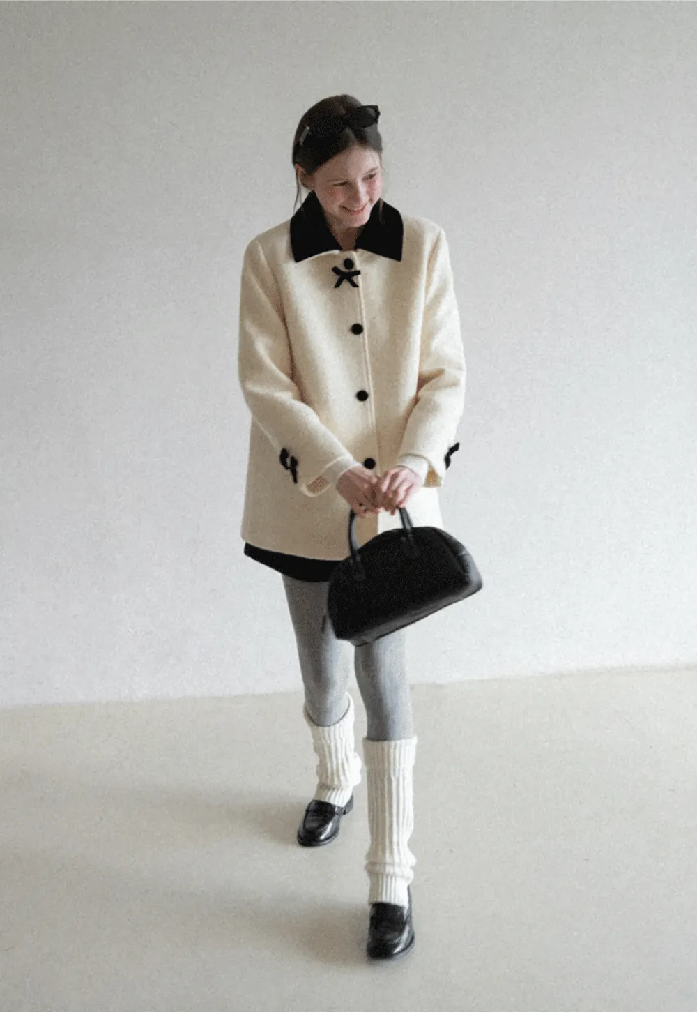 Elegant Wool Coat with Bow Detail and Contrasting Collar