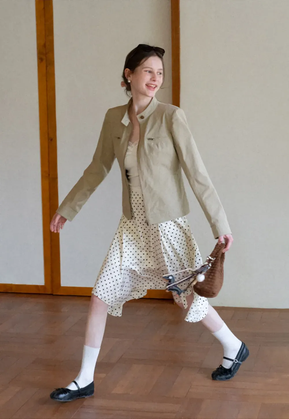 Polka dot asymmetrical hem skirt with pleats