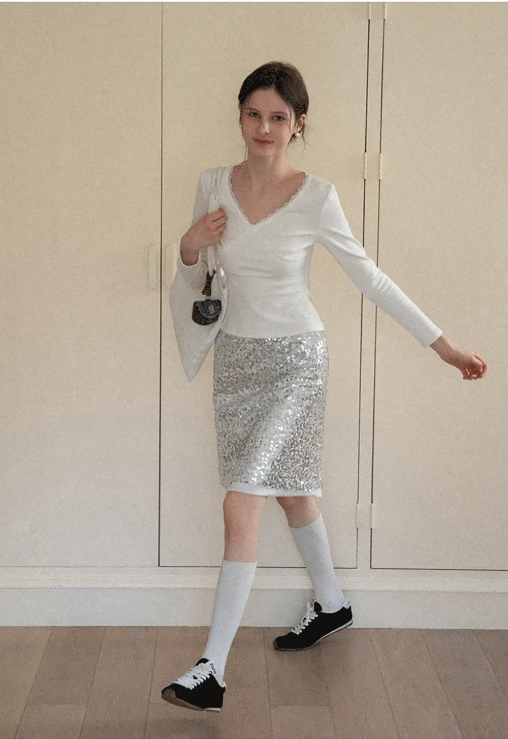 V neck long sleeve top with lace trim and fitted design