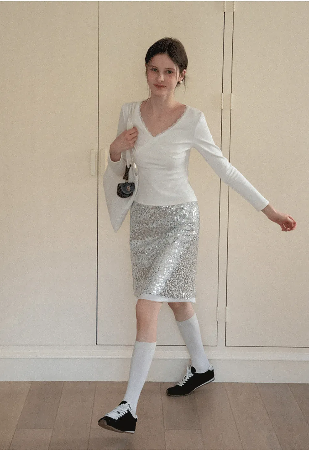 V neck long sleeve top with lace trim and fitted design