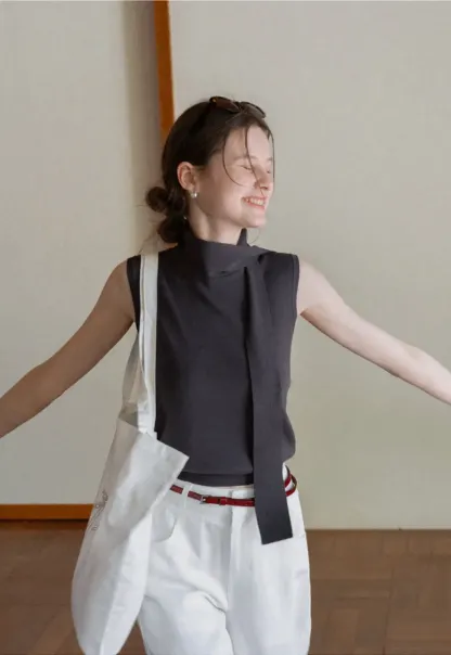 Sleeveless high neck knit top with side tie detail