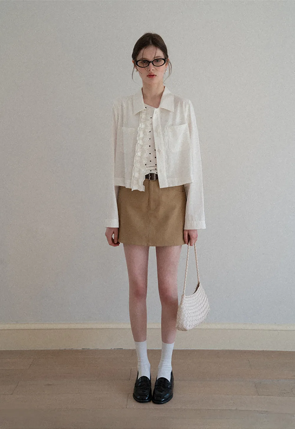 Short jacket with ruffled front placket and collar