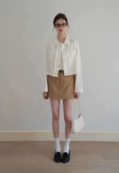 Short jacket with ruffled front placket and collar