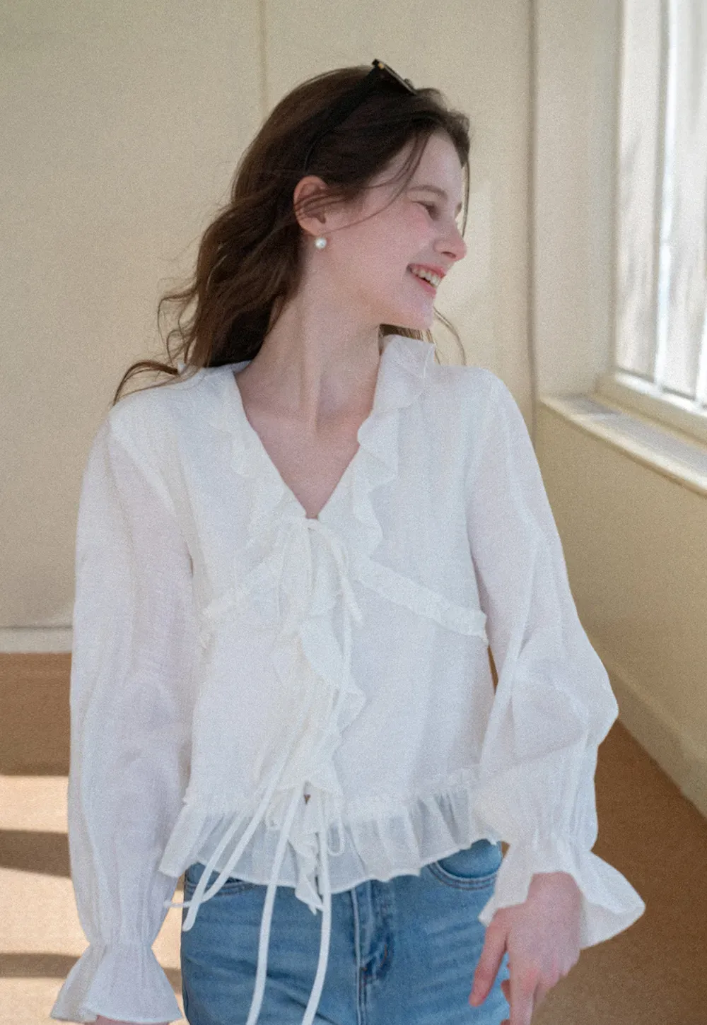 Elegant Blouse with Ruffle Detail and Tie Front Design