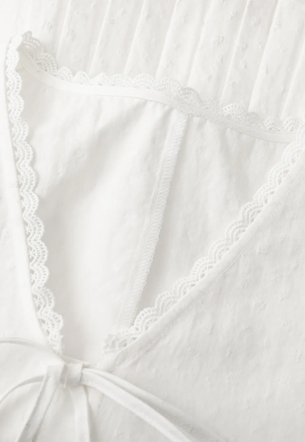 V neck short sleeve blouse with pleated hem and tie front