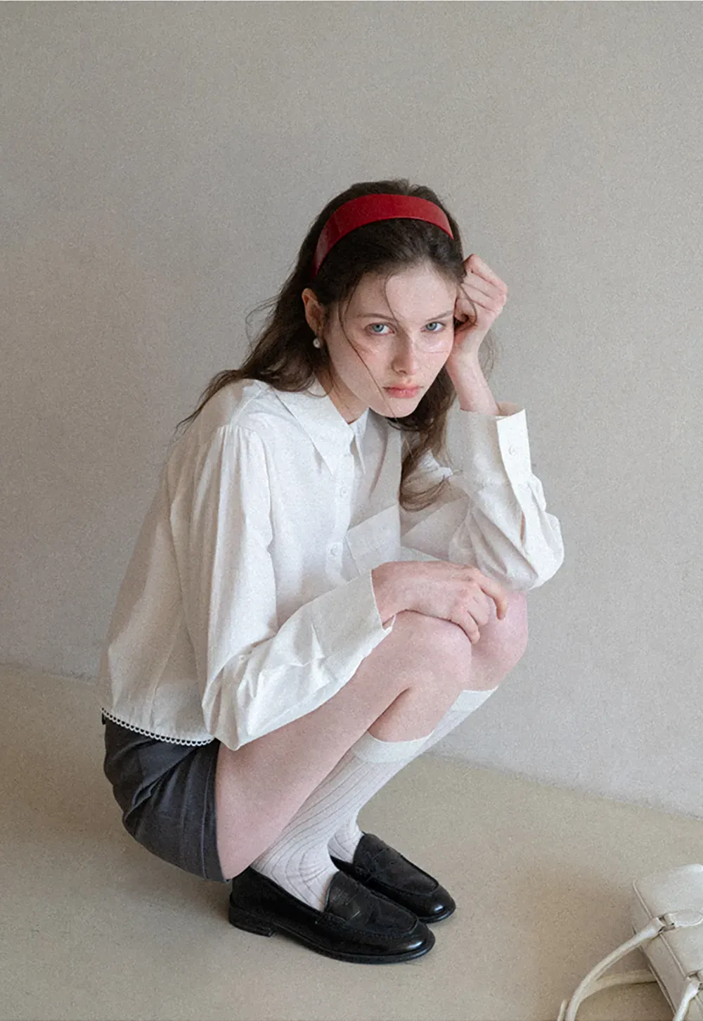 Long sleeve button front shirt with scalloped hem