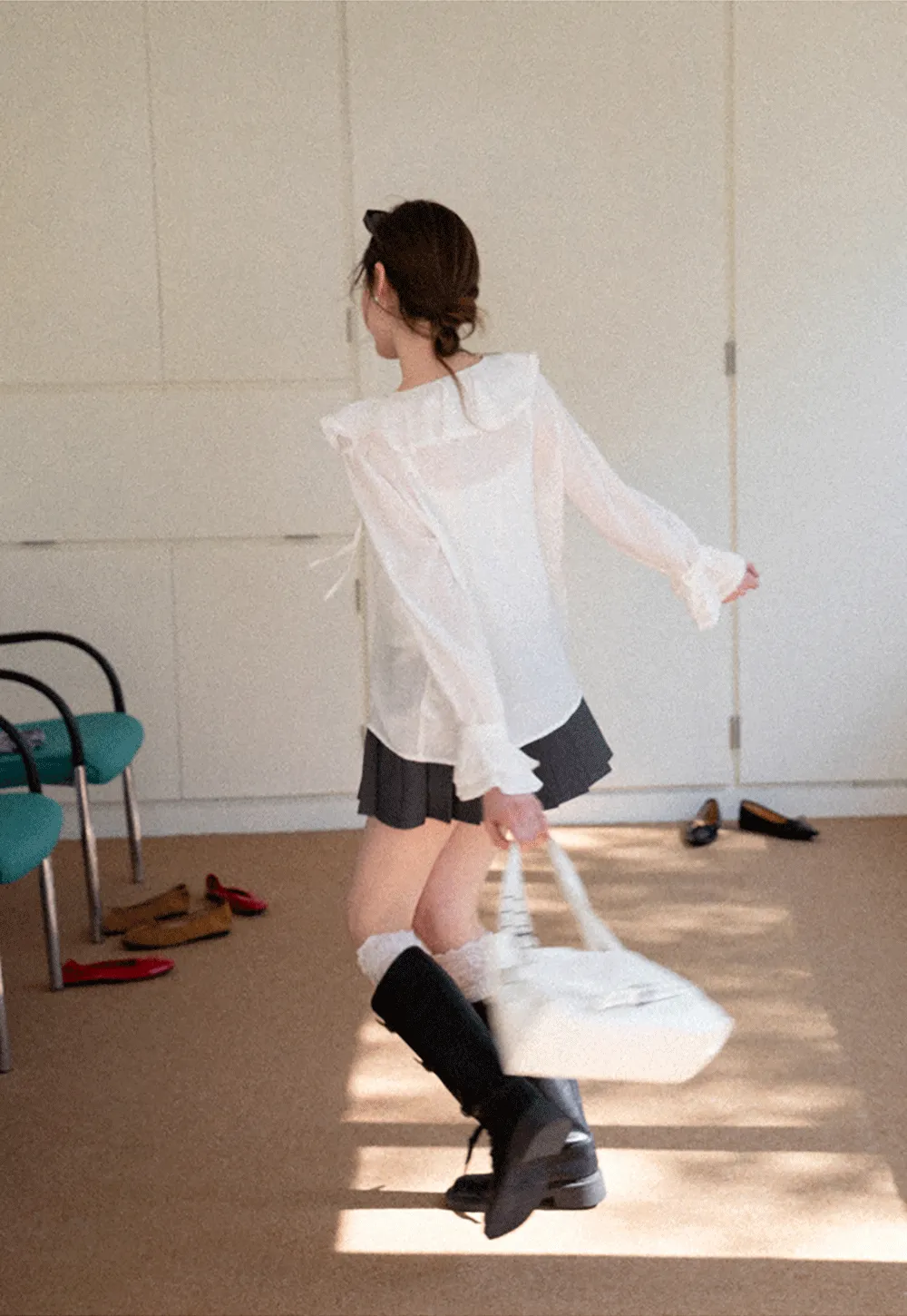 Elegant Blouse with Ruffled Neckline and Flared Sleeves