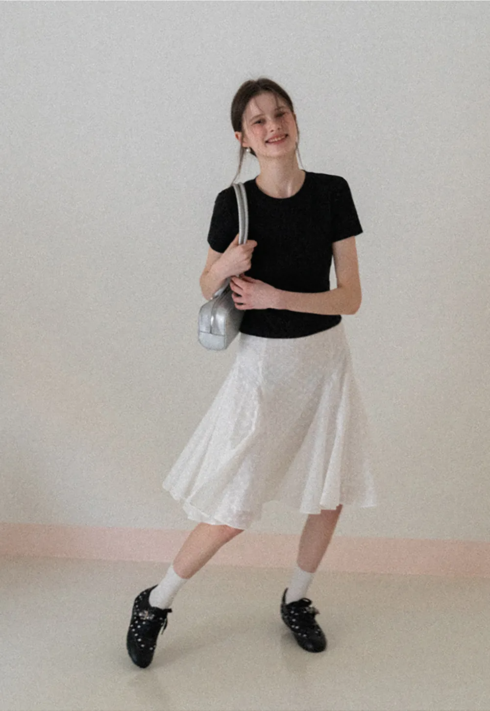 Flared pleated skirt with subtle texture
