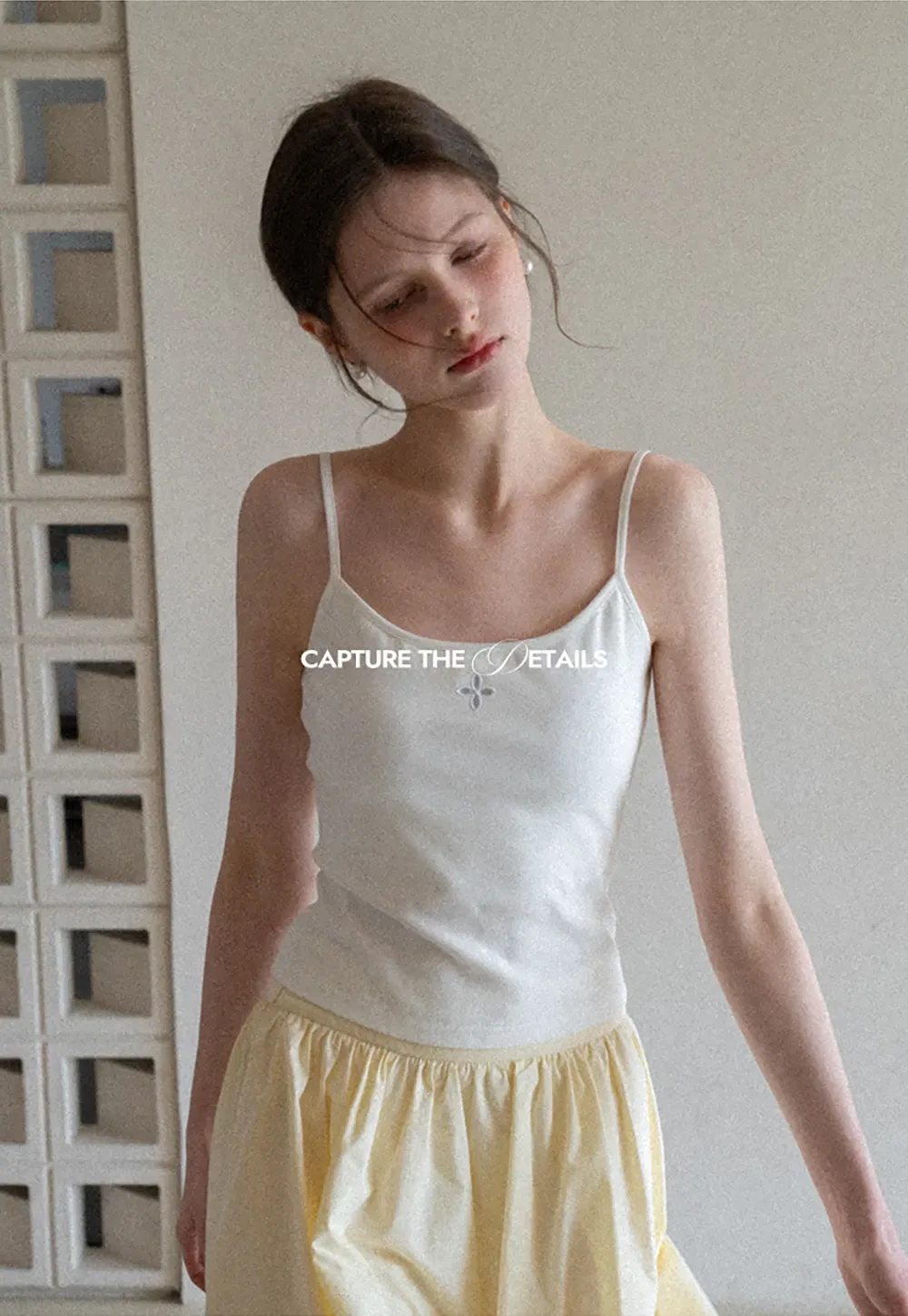 Gray tank top with small embroidered cross detail