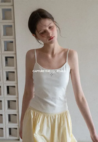 Gray tank top with small embroidered cross detail