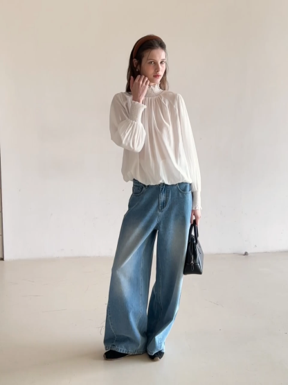 Elegant High Neck Blouse with Ruffled Cuffs and Hem