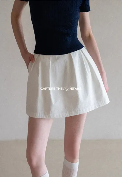 Plaid skirt with pleats and ruffled top