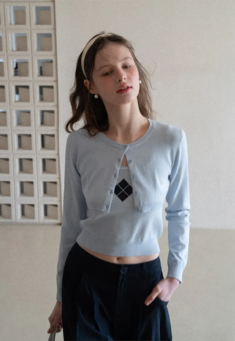 Woolen knit sweater with argyle pattern and buttons
