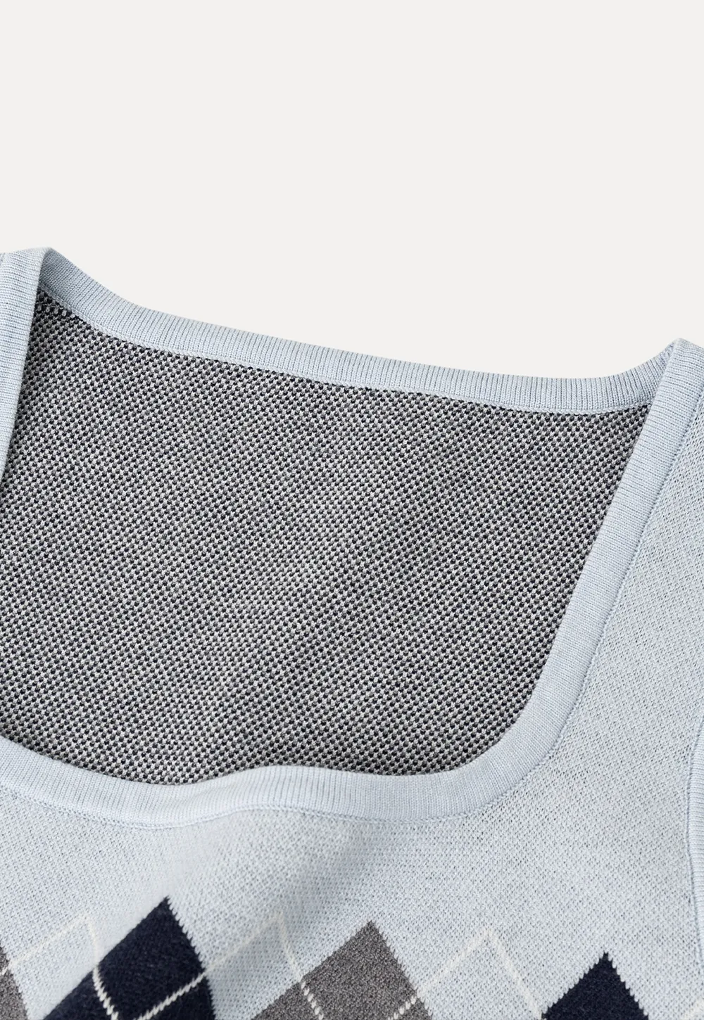 Woolen knit sweater with argyle pattern and buttons