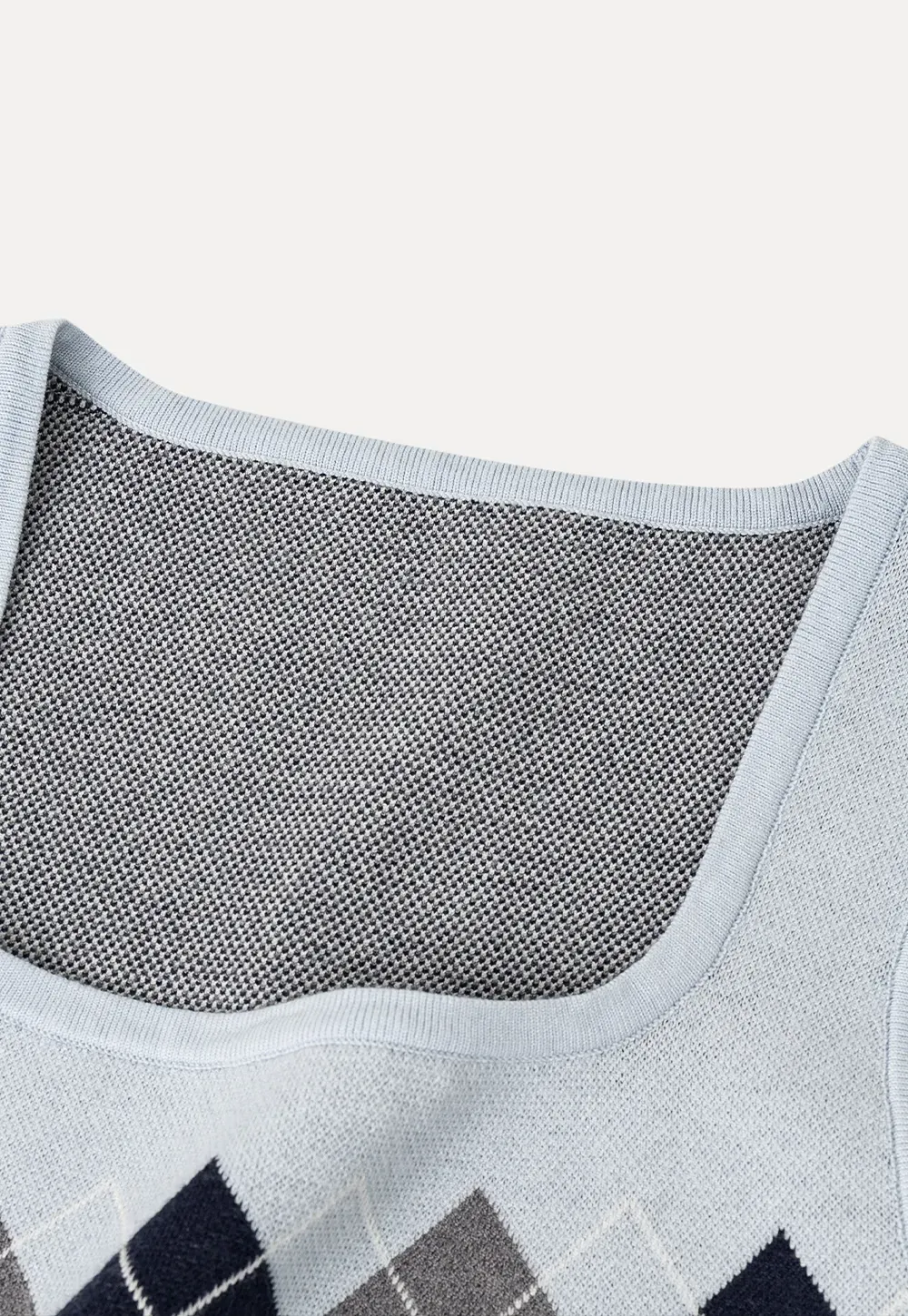 Woolen knit sweater with argyle pattern and buttons