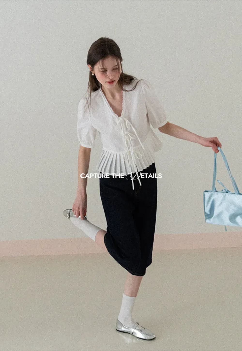 V neck short sleeve blouse with pleated hem and tie front