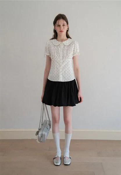 Polka dot shirt with ruffled sleeves and Peter Pan collar