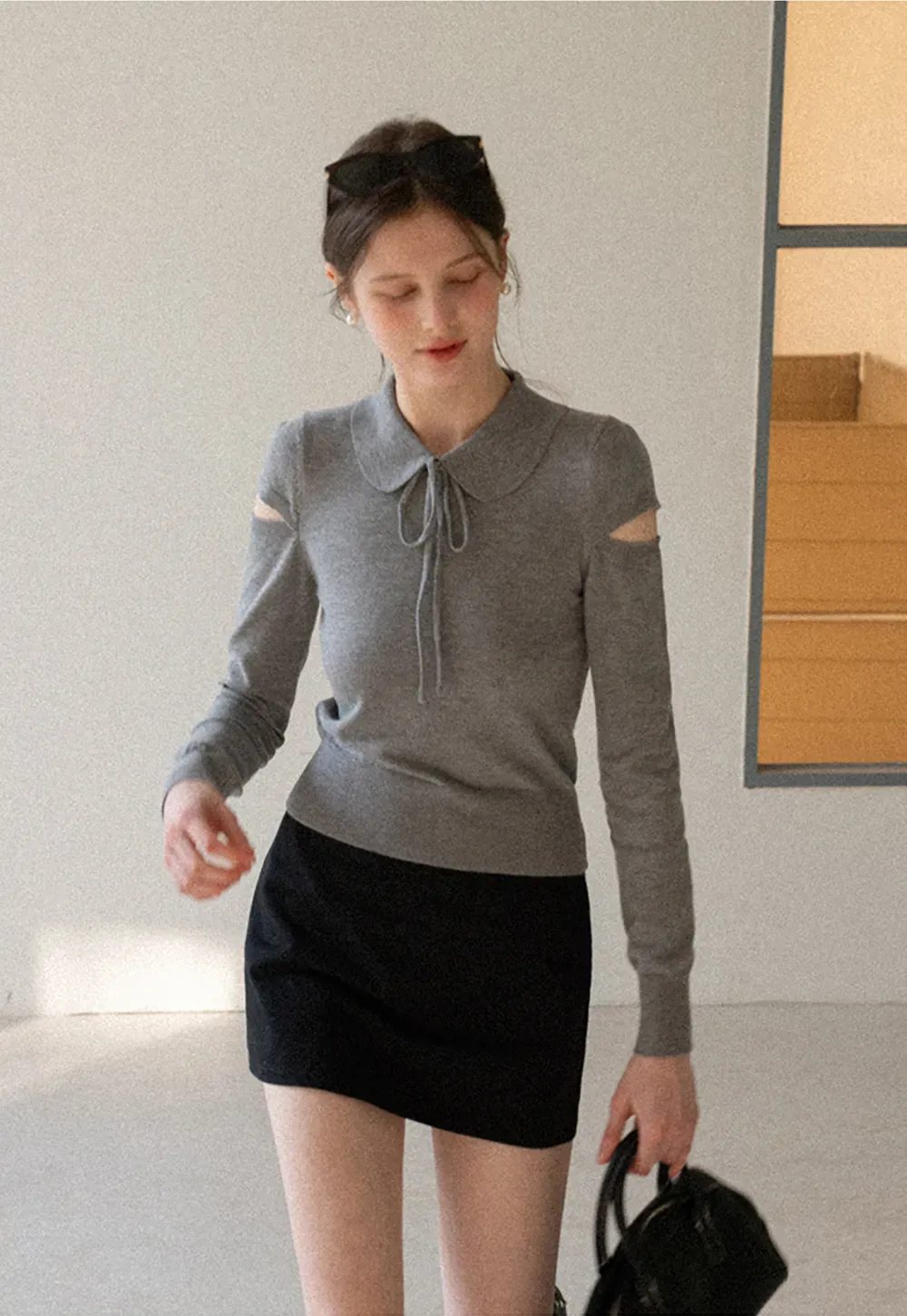 Elegant Knit Sweater with Bow Detail and Cutout Sleeves