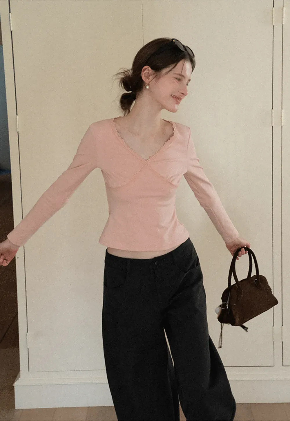 V neck long sleeve top with lace trim and fitted design