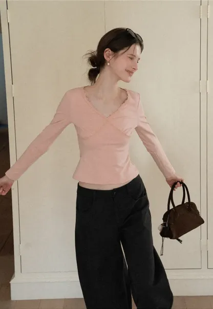 V neck long sleeve top with lace trim and fitted design