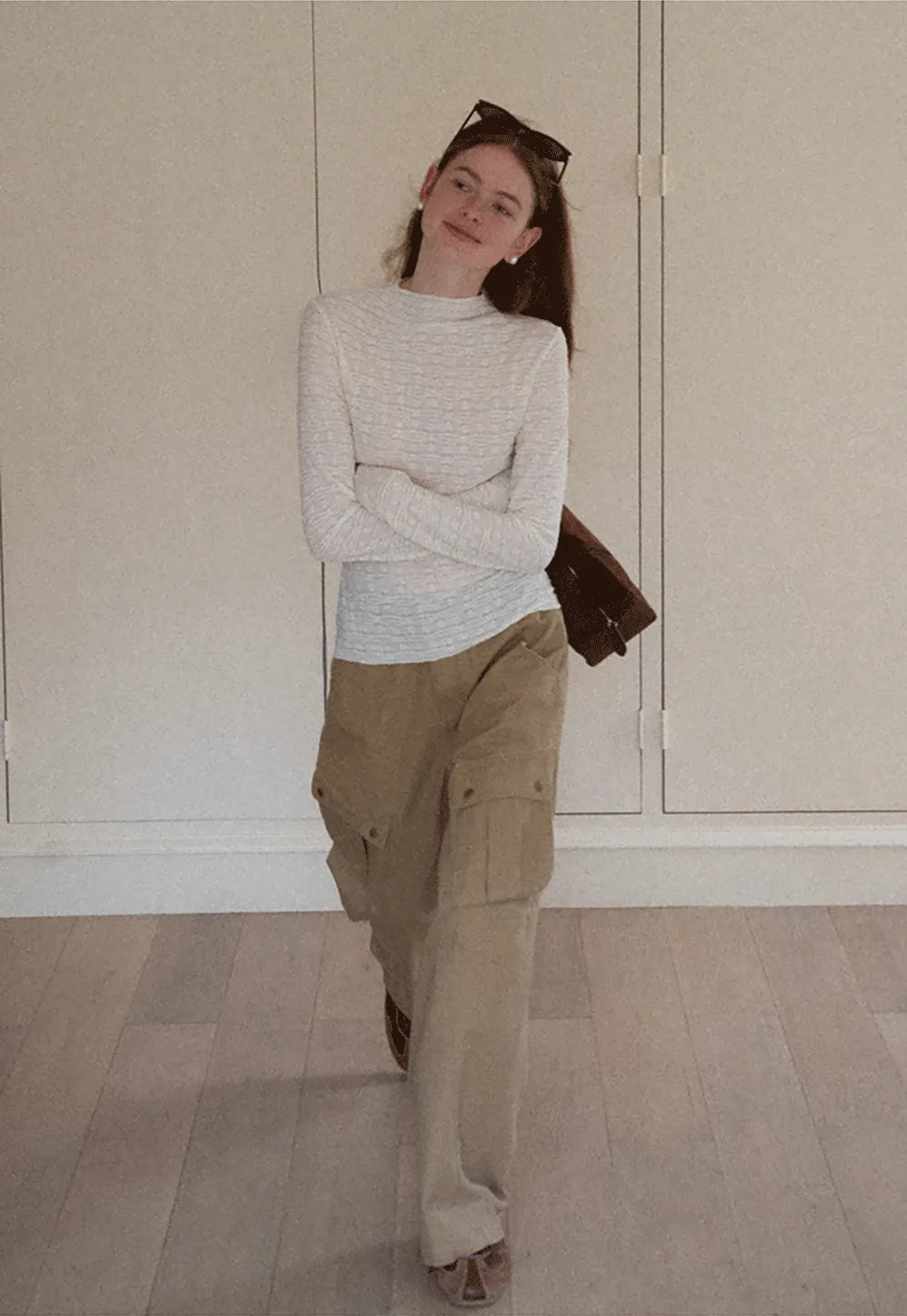 Elegant textured long sleeve top with subtle pattern design