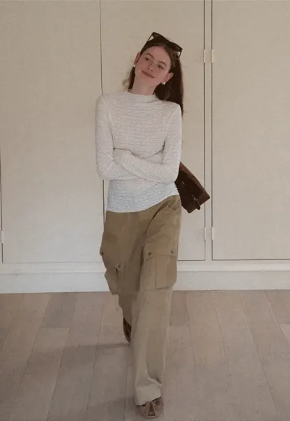 Elegant textured long sleeve top with subtle pattern design