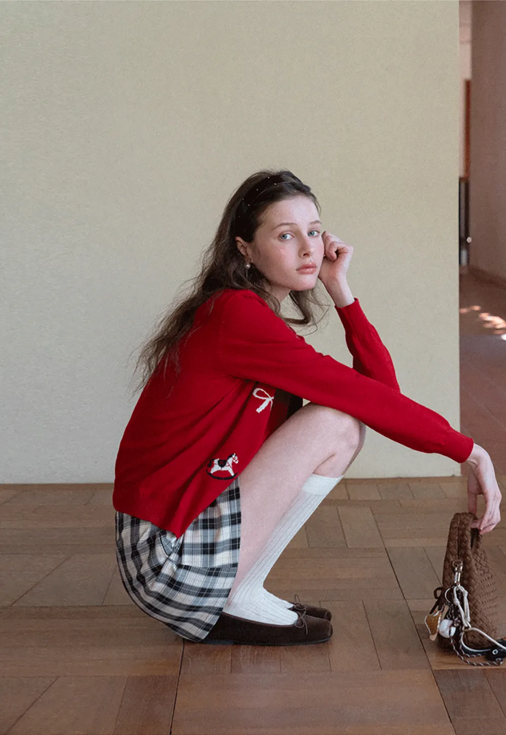 Woolen knit sweater with horse and bow motifs