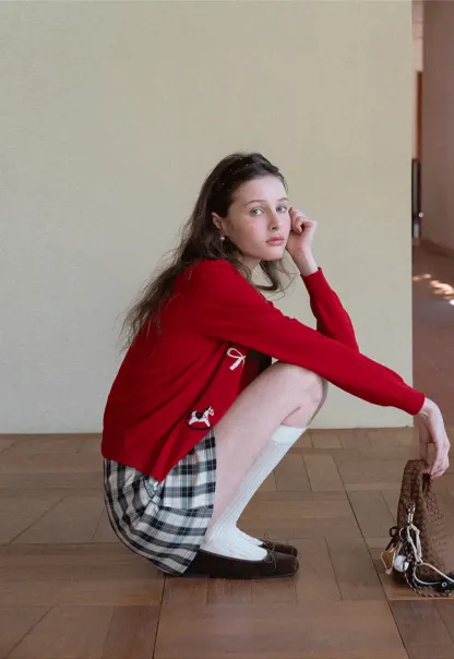 Woolen knit sweater with horse and bow motifs