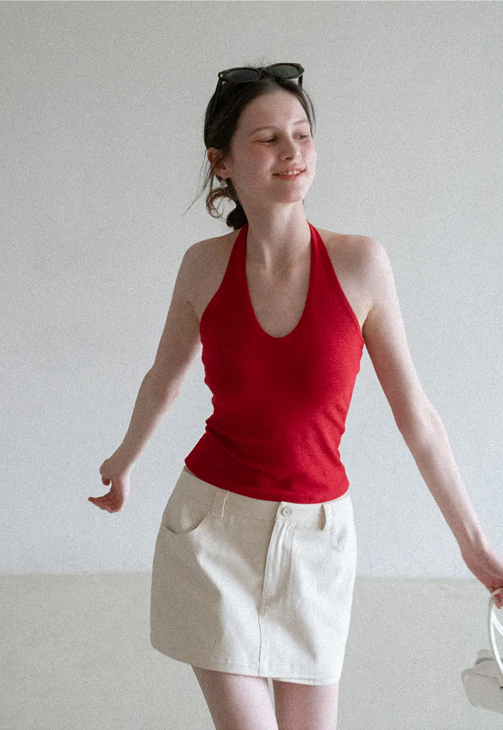 High waist pleated mini skirt with button front design