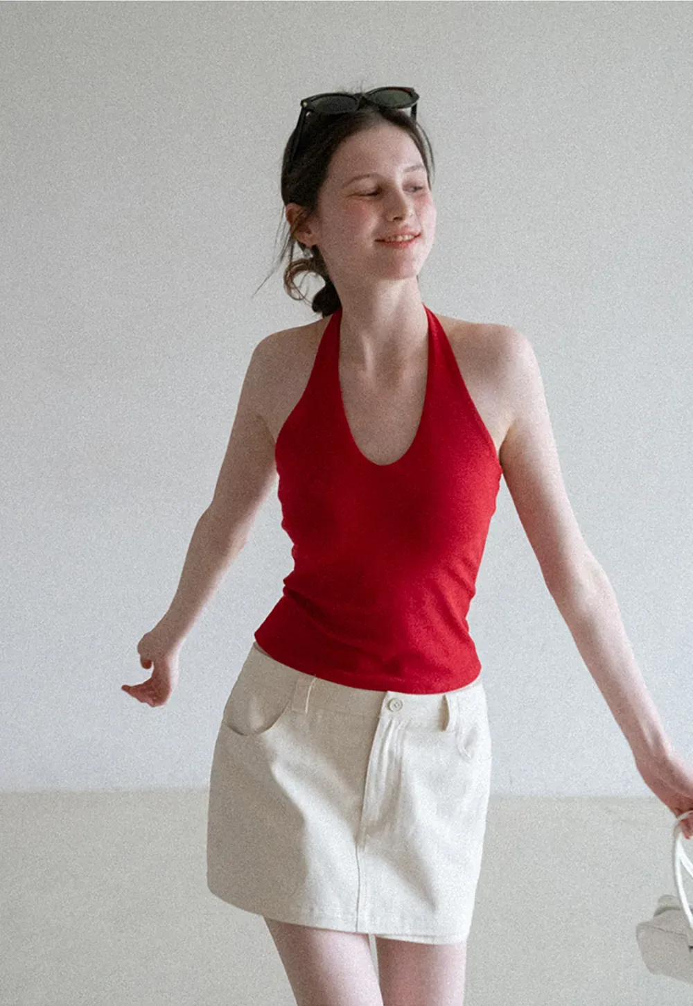 High waist pleated mini skirt with button front design