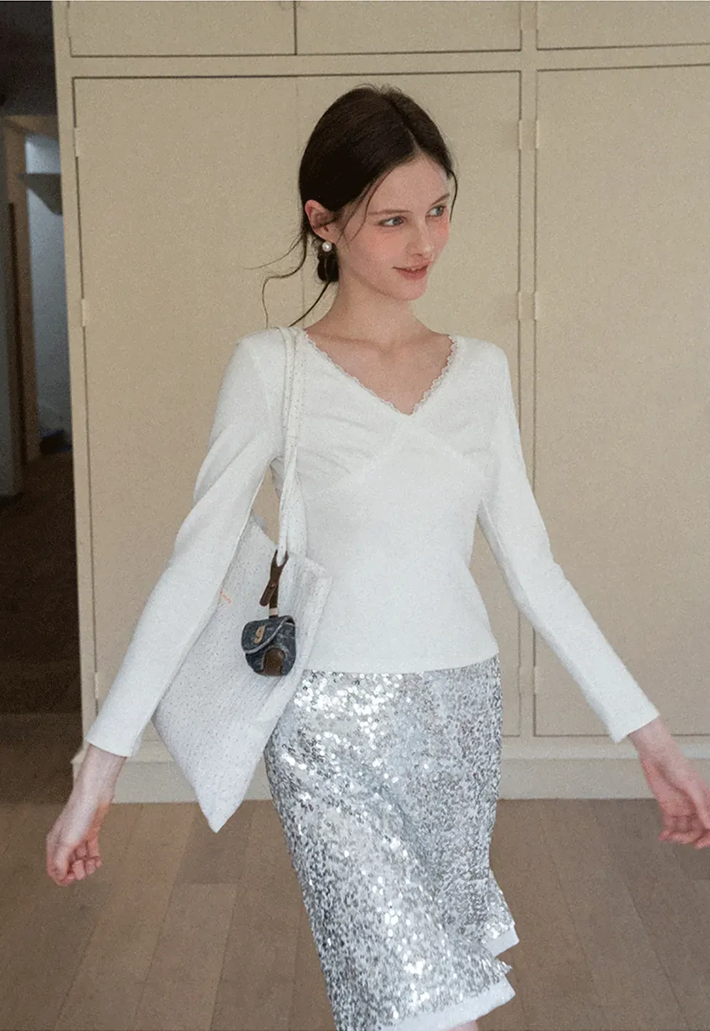 V neck long sleeve top with lace trim and fitted design