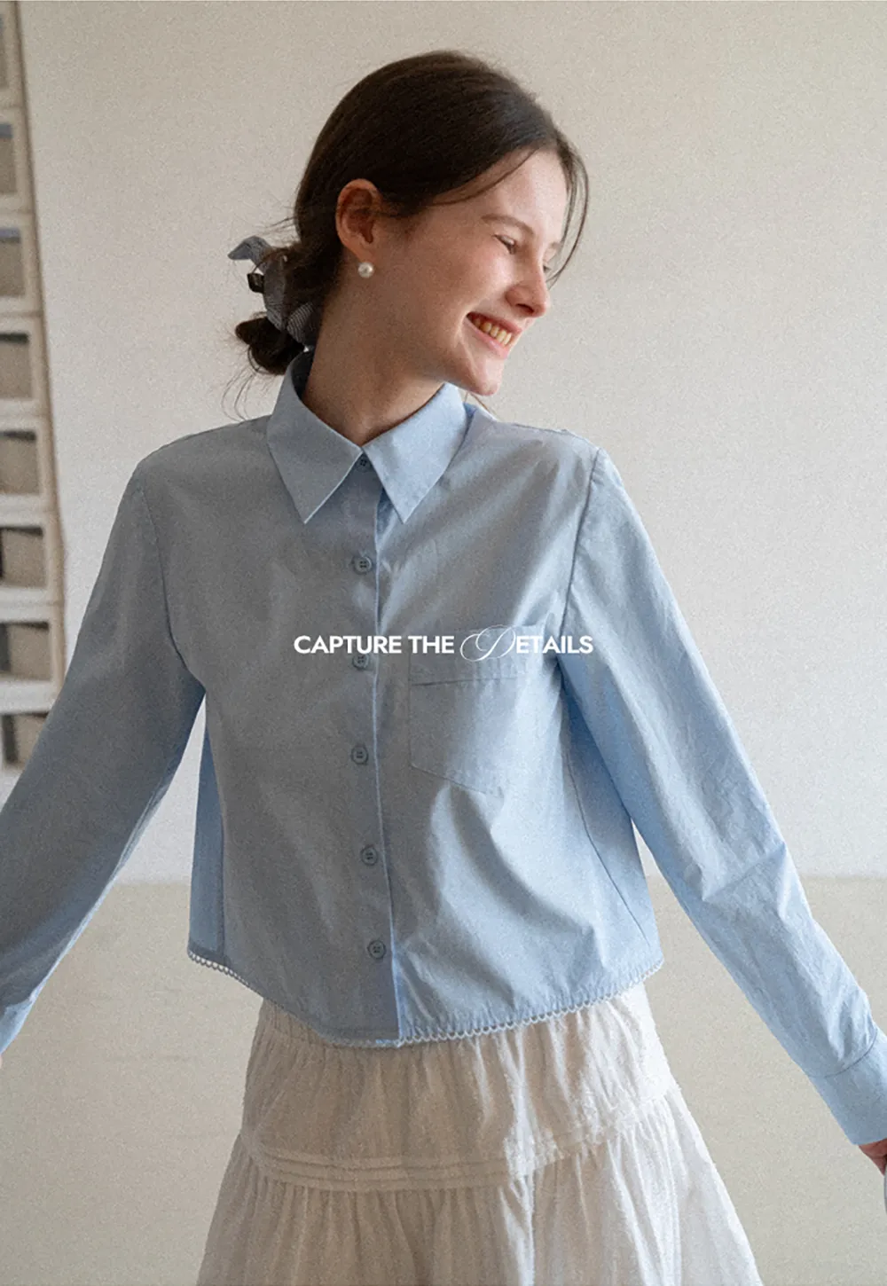 Long sleeve button front shirt with scalloped hem