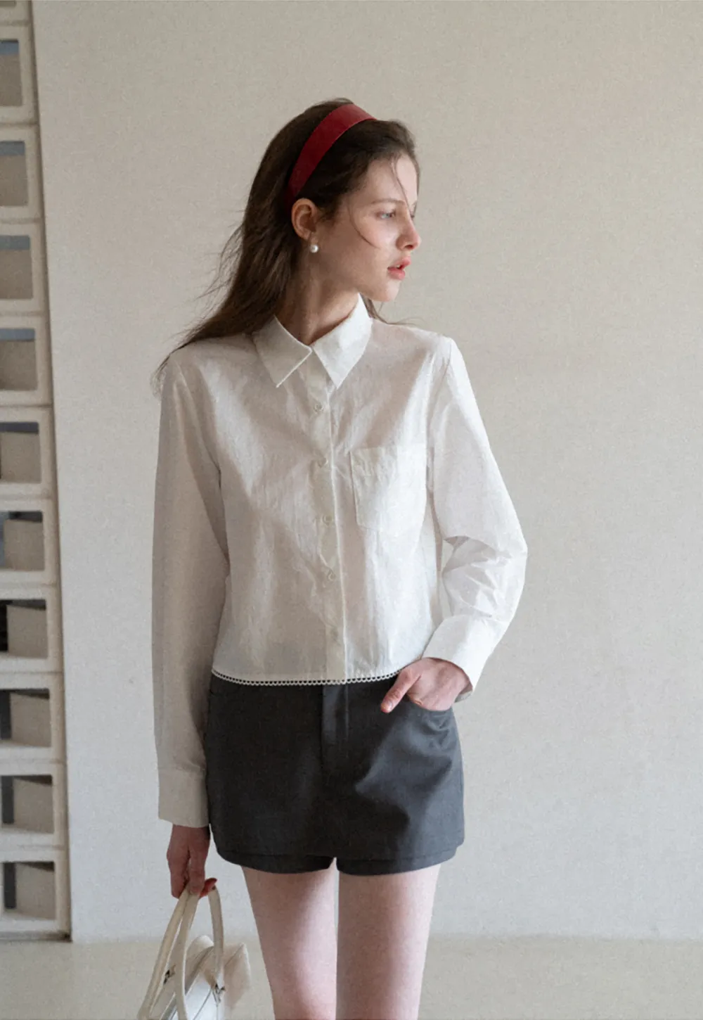 Long sleeve button front shirt with scalloped hem