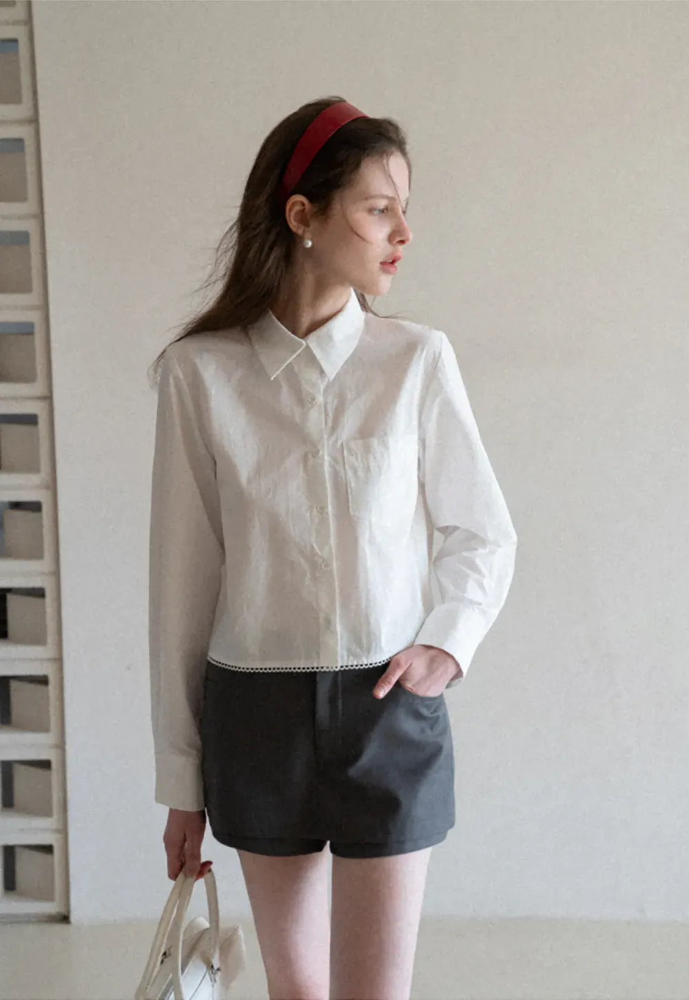 Long sleeve button front shirt with scalloped hem