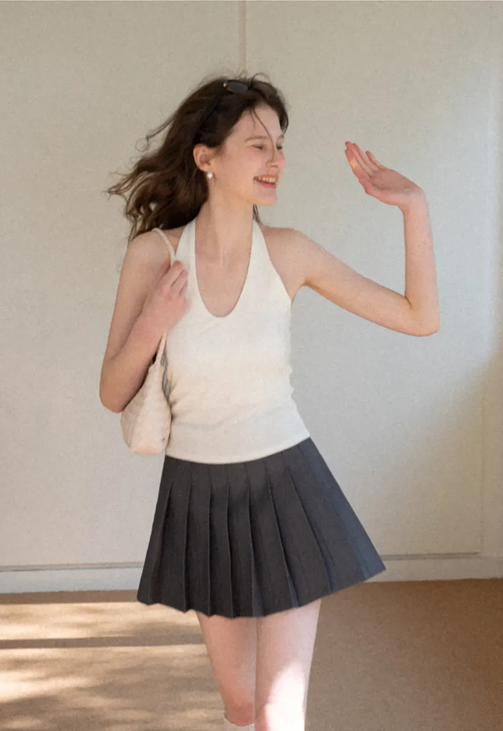 Pleated skirt with high waist and flared hem