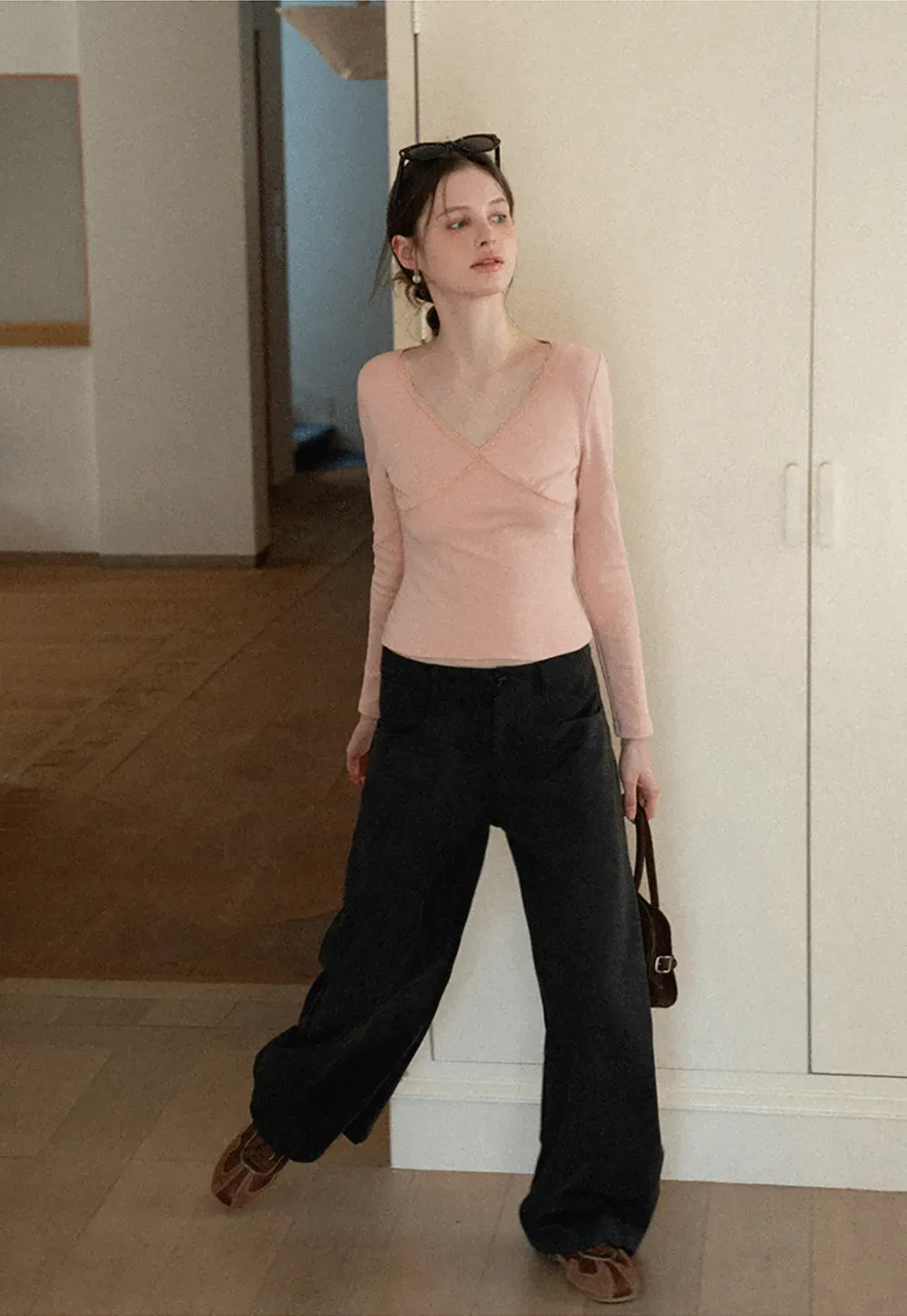 V neck long sleeve top with lace trim and fitted design