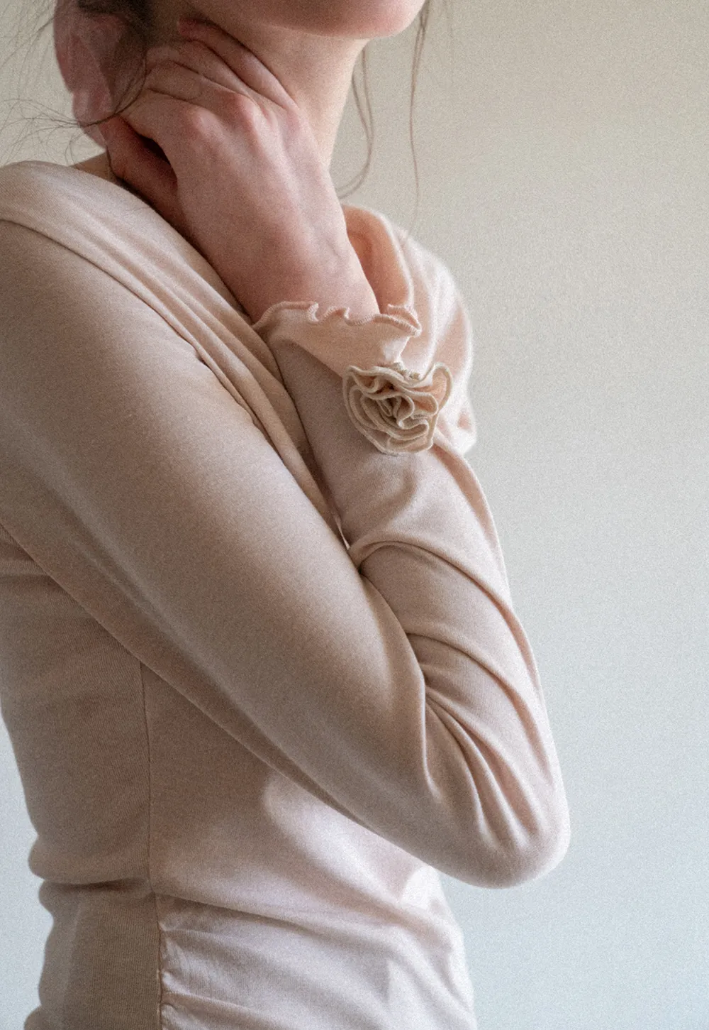 Long sleeve top with ruffled hem and cuffs